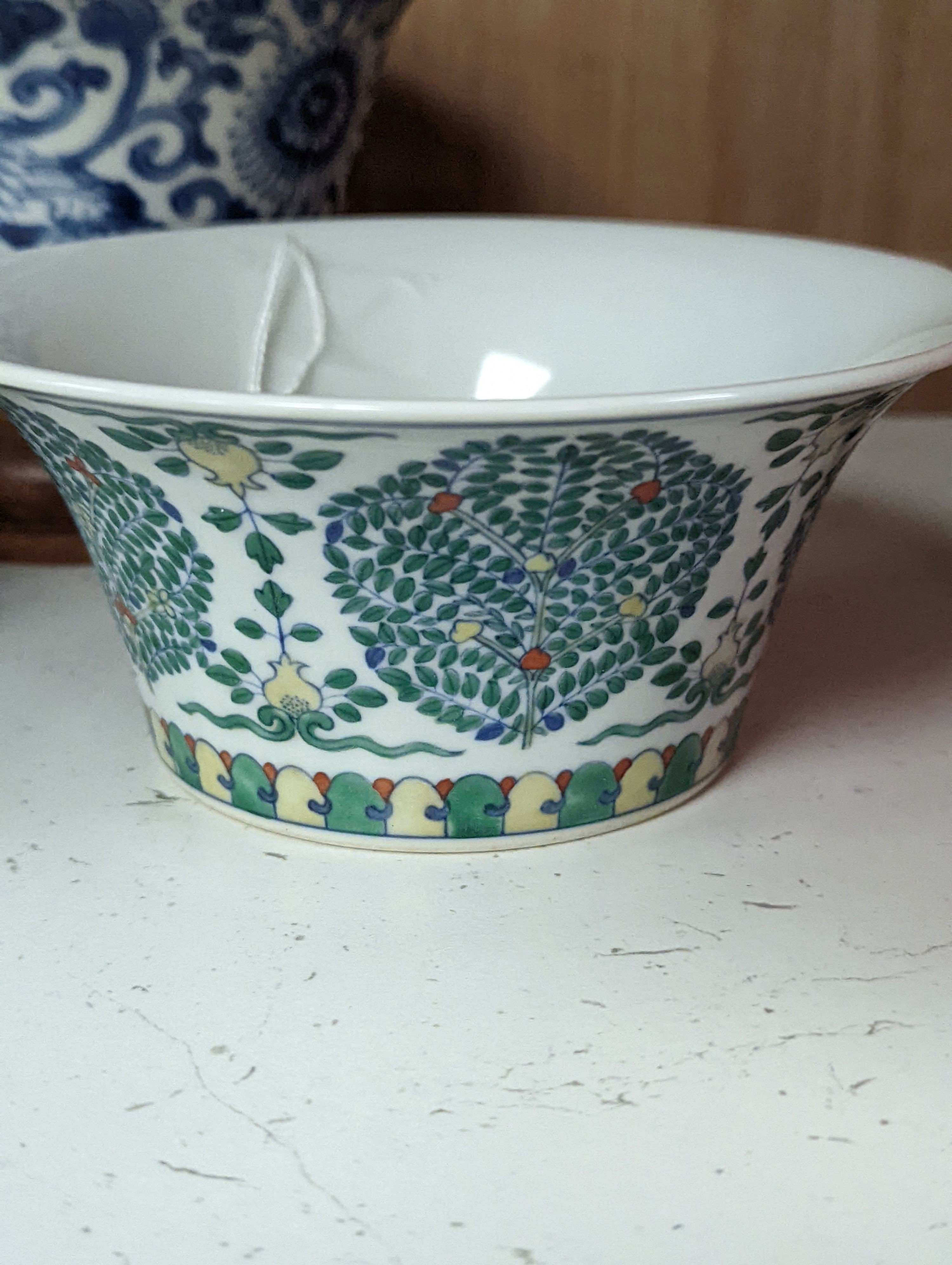 A Chinese blue and white bowl, Kangxi, 15cm. diam., a famille rose teapot stand, Yongzheng, and two doucai bowls